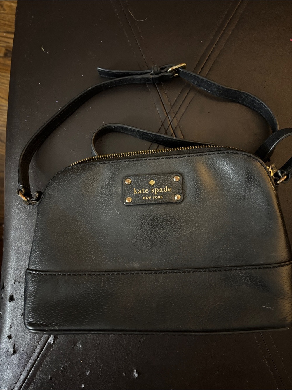 kate spade black leather dome crossbody with gold-tone plaque